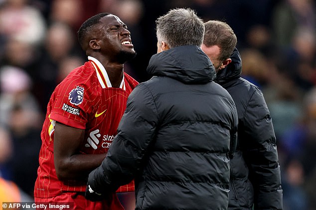 Liverpool dealt huge injury blow as in-form Ibrahima Konate leaves the field in AGONY during clash with Brighton... with defender forced to use his shirt as a makeshift sling