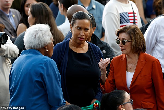 Speaker Emerita Nancy Pelosi (right) was caught on camera in a heated discussion with former acting DNC Chair Donna Brazile (left) as Washington, D.C. Mayor Muriel Bowser (center) stood between them