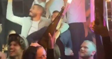 A group of Leicester players including Harry Winks (behind bottle) and Conor Coady (left) have been spotted jubilantly partying just hours after their 2-1 defeat against Chelsea on Saturday