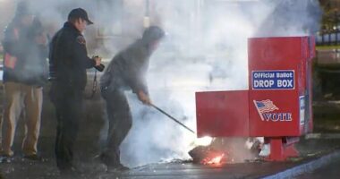 Authorities seen working to put out a fire at a ballot box in Vancouver, WA started early Monday morning. It was one of two fires set at two ballot boxes in two separate states