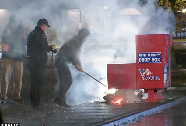 Authorities seen working to put out a fire at a ballot box in Vancouver, WA started early Monday morning. It was one of two fires set at two ballot boxes in two separate states