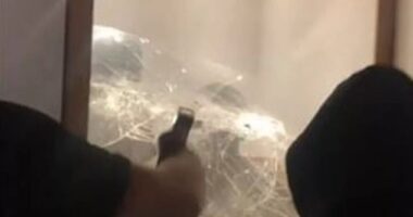 The video shows the moment two people smash through the glass where the statues were