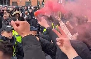 Red flares were lit and insults were traded