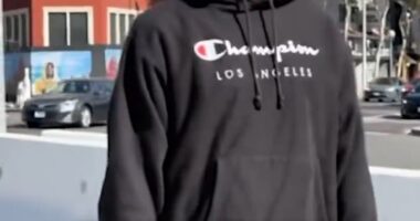 A Trump supporter was subjected to a vulgar rant by this unidentified man who she called 'a lovely Kamala supporter' after he spotted her MAGA-themed shoes