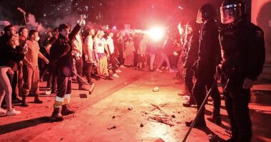 Protesters clash with police in front of city hall during a demonstration to demand the resignation of Valencia Regional President Carlos Mazon in Valencia on November 9