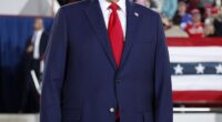 A Hollywood spray tan technician has shared her theory on the mystery method behind Donald Trump 's infamous tan. (Trump pictured in Raleigh, North Carolina on Monday)