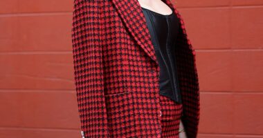 Taylor Swift stunned in a matching red jacket and skirt for the Chiefs' game against Denver