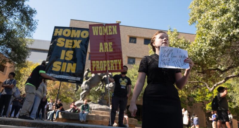 Texas campus in uproar as protesters hold signs declaring ‘women are property’ on quad after Trump victory