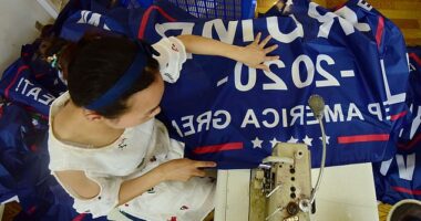 Yiwu, China houses one of the world's largest wholesale market places in the world. Pictured: A Chinese employee sews a Trump 2020 Keep America Great flag