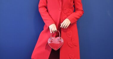 Racing enthusiast Viera Macikova lead the trend in a scarlet suit with a matching hat and heart-shaped bag