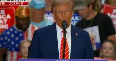 Trump was boasting about how no one ever leaves his rallies early just as some one was seemingly leaving behind him