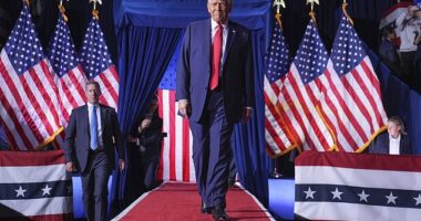 Donald Trump arrives after midnight at the final rally of his campaign in Grand Rapids, Michigan