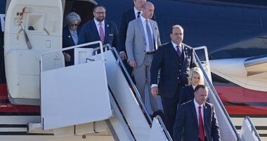 From l-r., Susie Wiles, Jason Miller, Elon Musk, Stephen Miller, Boris Esphteyn, Natalie Harp and Dan Scavino, walk off President-elect Donald Trump's as he arrives,