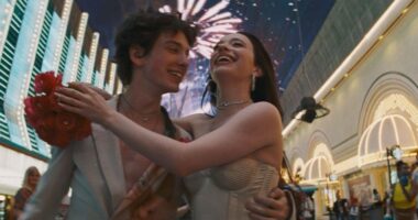 Mikey Madison as Ani and Mark Eydelshteyn as Ivan celebrating their wedding in Vegas in Anora.