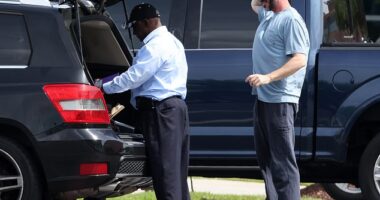 Feds raided the South Carolina home of pastor John-Paul Miller of the Solid Rock Church on Friday. The 45-year-old is seen looking on at agents during the hourslong operation here