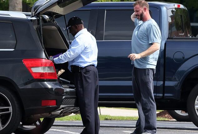 Feds raided the South Carolina home of pastor John-Paul Miller of the Solid Rock Church on Friday. The 45-year-old is seen looking on at agents during the hourslong operation here