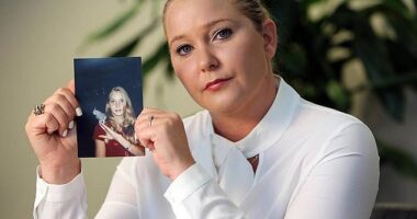 Virginia Giuffre, with a photo of herself as a teen, when she says she was abused by Jeffrey Epstein