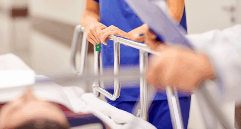 women lies in hospital bed