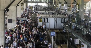 Spain's green energy revolution was under scrutiny yesterday for making massive power cuts 'much worse' as millions were plunged into blackout chaos. Pictured: Crowds waiting for a taxi at Barajas Airport in Madrid