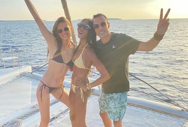 Naomi Campbell wowed in a skimpy yellow bikini as she shared rare Instagram snaps with her two children and friends during Maldives getaway on Tuesday