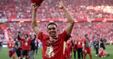 Trent Alexander-Arnold celebrates after Liverpool clinched the Premier League title on Sunday