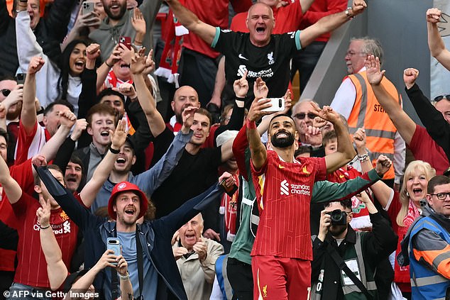 Football fans have questioned the sponteneity behind Salah's selfie with Liverpool fans