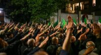 Thousands of neo-fascists rallied in Italy last night, performing the 'Roman salute' in honour pf the death of a member of the extreme right group from 50 years ago