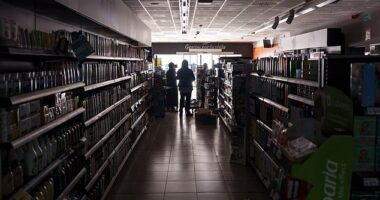 A man works in a restaurant during a power outage, in Madrid, Spain, 28 April 2025