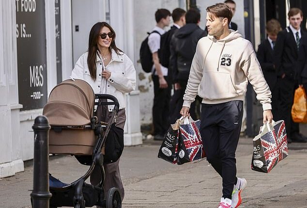 Michelle Keegan looked effortlessly stylish on Friday as she stepped out for a family walk with husband Mark Wright, baby Palma, and Mark's younger sister Natalya
