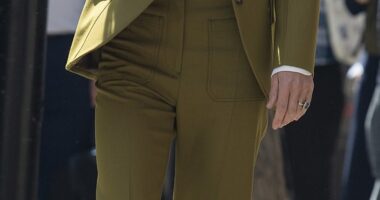 Kate Middleton seen arriving at 180 Strand on Tuesday wearing a £1,340 willow green trouser suit from Victoria Beckham's Spring/Summer collection