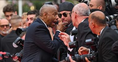 Denzel Washington lashed out an overzealous photographer as he attended the Cannes premiere of his movie Highest 2 Lowest on Monday