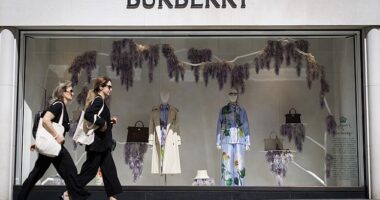 Two women walk past a Burberry branch on New Bond Street in London on May 14, 2025