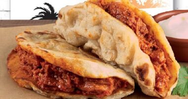 Aldi's popular treat is back on shelves: A butter chicken 'naanwich', a sandwich that comes with the creamy Indian classic served between tasty naan bread (pictured)