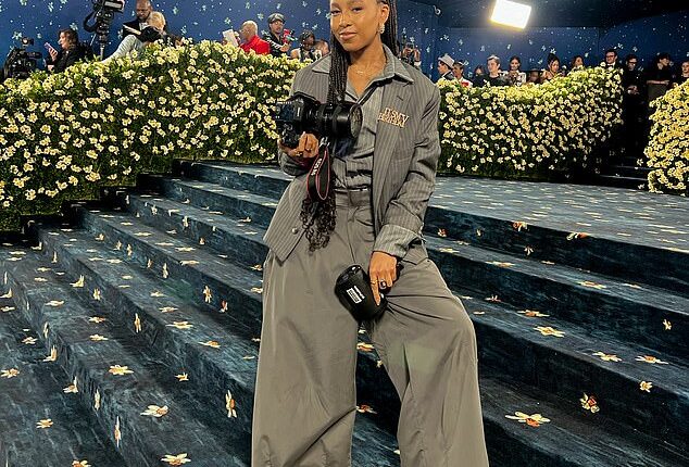 Denise Stephanie Hewitt was sitting at a lunch table at a New York University freshmen orientation event she was working at when the Vogue team emailed asking her to shoot Simone Biles before the 2021 Met Gala (pictured: Hewitt at the 2025 Met Gala)