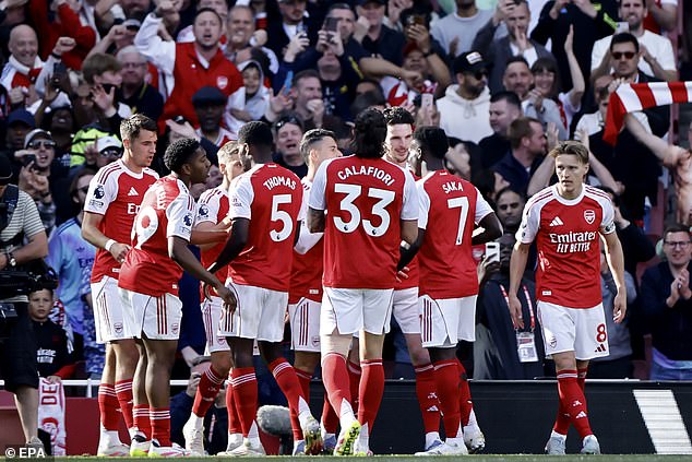 Arsenal all-but secured second place in the Premier League by beating Newcastle on Sunday