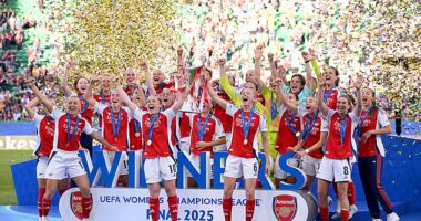 Arsenal Women celebrate with the Champions League trophy after beating Barcelona