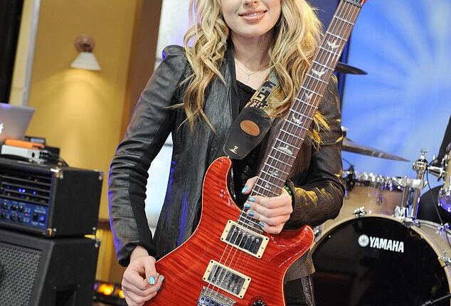 She's the Aussie guitar goddess who once rocked the stage with Prince and Michael Jackson ¿ but Orianthi looked worlds away from her edgy rocker roots in stunning new photos