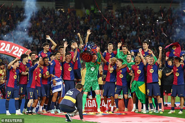 Barcelona captain Marc-Andre ter Stegen lifts the trophy after Sunday's clash with Villarreal