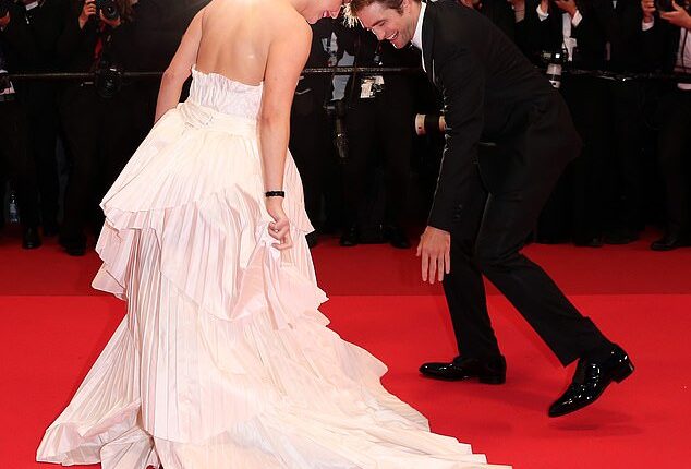 It's film's most glamorous event, but even the world's biggest stars suffer wardrobe malfunctions (pictured: Robert Pattinson accidentally stepping on Jennifer Lawrence's dress at Cannes Film Festival 2025)