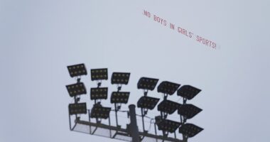 A banner protesting a transgender athlete's participation in the California high school track-and-field championships was flown over the meet in Clovis Friday