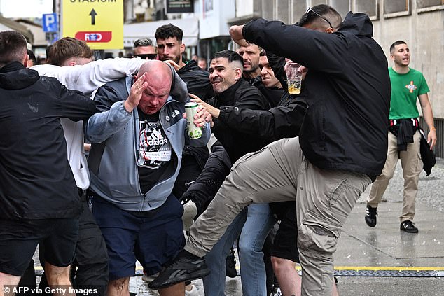 A Chelsea fan was battered and left with a bloody nose after being attacked by Betis fans