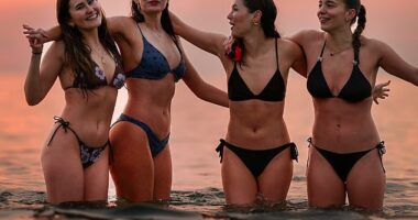 Students from St Andrews University take part in the traditional May Day dip into the North Sea