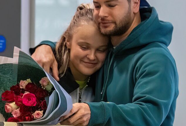 Chris Hughes enjoyed a cosy night in with JoJo Siwa on Sunday after he picked her up at Heathrow airport with a large bouquet of red roses