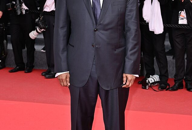 Denzel Washington sparked fan concerns after skipping a press conference Tuesday at the Cannes Film Festival after a tense confrontation with a photographer on Monday. But his rep tells DailyMail.com that his absence was planned ahead of time; seen Monday
