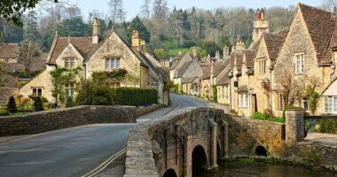 Enraged residents of the UK's 'most beautiful village', Castle Combe, Wiltshire (pictured), say their privacy has been disturbed by increasing numbers of tourists using drones to take aerial footage of the houses and streets