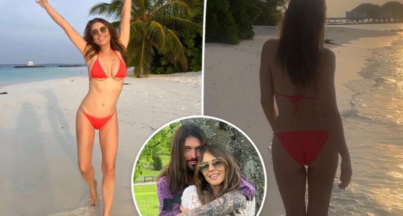 Elizabeth Hurley frolics in red bikini after debuting Billy Ray Cyrus romance