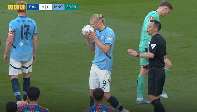 Manchester City striker Erling Haaland pictured kissing the ball during Saturday's FA Cup final