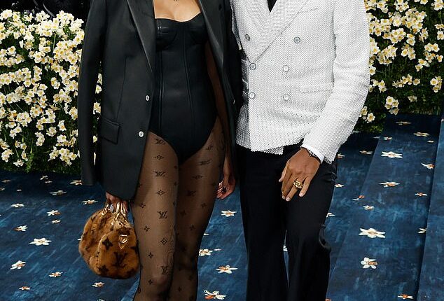 Louis Vuitton menswear creative director Pharrell has been criticised for the luxury brand's lacklustre Met Gala looks - including one very controversial ensemble that was widely condemned online. He is pictured here with his wife Helen Lasichanh