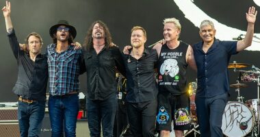 The Foo Fighters have fired a key band member in a shock decision eight months after Dave Grohl's affair rocked the group - pictured Chris Shiflett, Rami Jaffee, Dave Grohl, Nate Mendel, Josh Freese and Pat Smear at Glastonbury in 2023