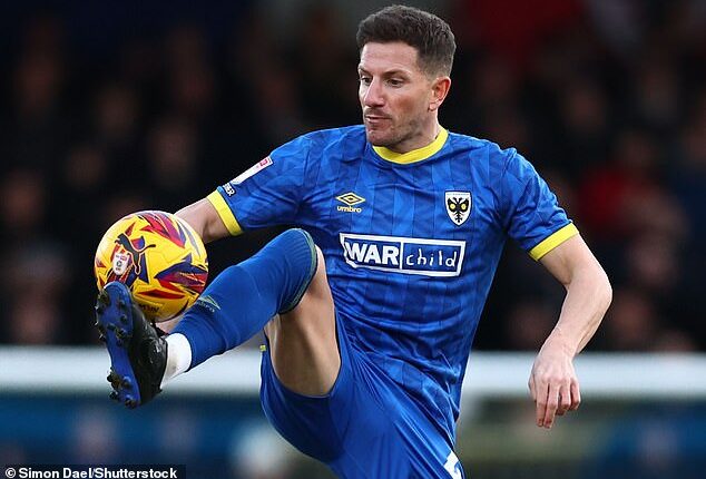 AFC Wimbledon's Sam Hutchinson underwent heart surgery after being rushed to hospital